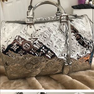 Louis Vuitton silver duffle